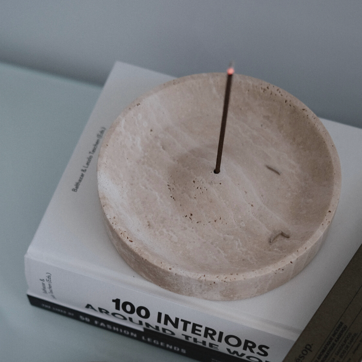 Handcrafted travertine incense tray showcasing organic textures, suitable for zen-inspired interiors.